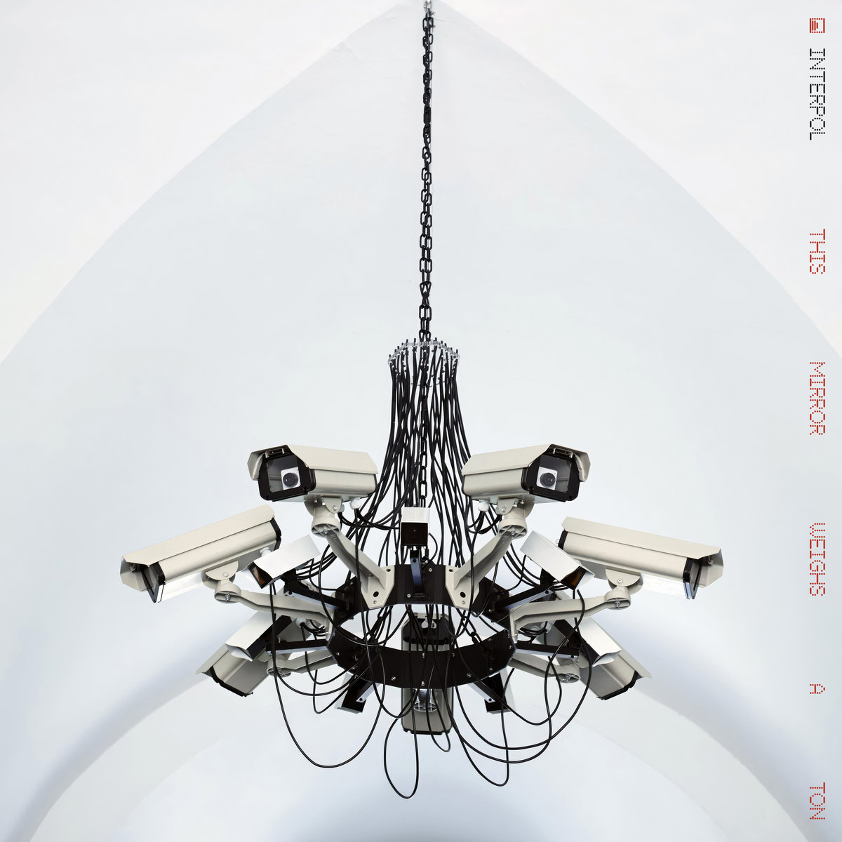 Interpol's This Mirror Weighs a Ton album cover, featuring Addie Wagenknecht's surveillance-camera chandelier Asymmetric Love Number 2
